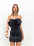 Abito con maxi fiocco e gonna in paillettes