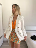 Giacca bianca con bottoni oro