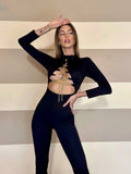 Tuta aderente con catena oro