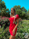 Abito rosso schiena incrociata