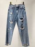 Jeans con strappi sfrangiato sotto