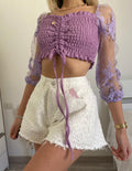 Short bianco a farfalla con strappini