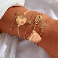 Bracciale con mondo e nappina rosa
