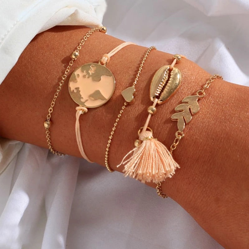 Bracciale con mondo e nappina rosa