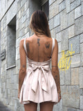 Abito beige schiena aperta e fiocco