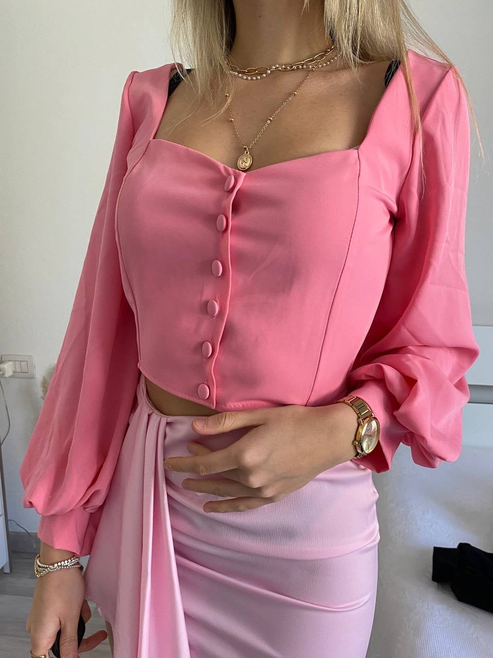 Top con bottoncini rosa