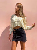 Gonna di jeans con borchie e trasparenze nera