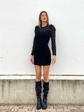 Abito nero con maniche in pizzo