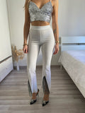 Pantaloni a zampa con strass bianco