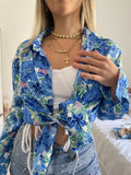 Top bianco con spalline in strass