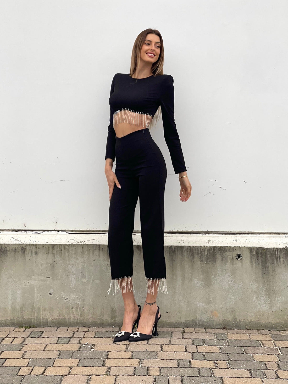 Pantalone con frange in strass