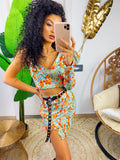 Completo top e gonna con fiori arancio base verdeacqua