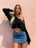 Gonna di jeans con borchie e trasparenze