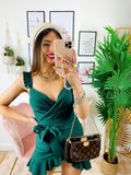 Abito corto verde bottiglia con gonna incrociata