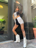 Jeans bianco e nero con borchie
