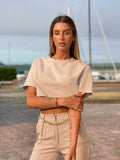 Completo maglia crop e pantalone beige