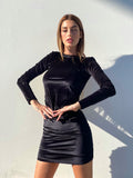 Abito in velluto schiena aperta con strass nero