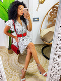 Abito a fiori bianco con roselline rosse
