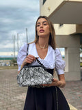 Pochette a mano con catena