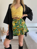 Top in pizzo giallo con pizzo