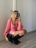 Top con bottoncini rosa