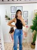 Jeans a vita alta con spacco inferiore