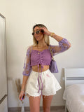 Short bianco a farfalla con strappini