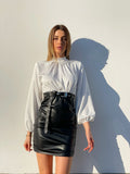 Abito con camicia di raso e gonna in ecopelle