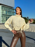 Maglione panna con trecce