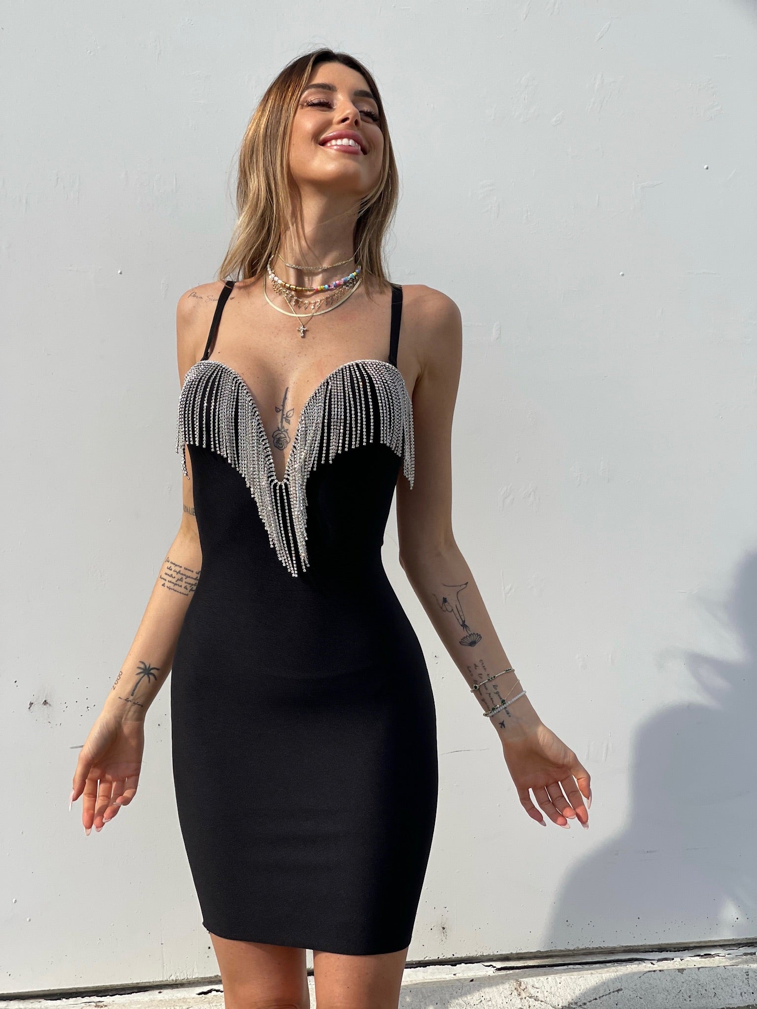 Abito bustier nero con frange