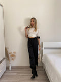 Pantalone nero con piume