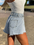 Short jeans a farfalla con strappini