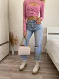 jeans con dettaglio aperture e catene