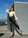 Pantalone in ecopelle con cintura