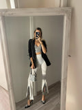 Pantaloni a zampa con strass bianco