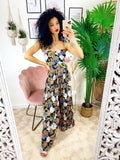 Tuta floreale con pantalone a pieghine