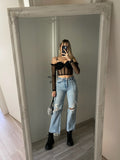 Jeans con strappi e strass