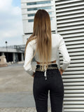 Top bianco a costine con lacci