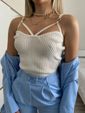 Top bianco con anelli oro