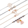 Bracciale con infinito e dettagli rosa grigio