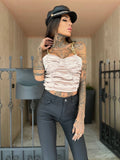 Top in raso beige con spalline in catena