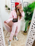 Completo sportivo con righe Rosa