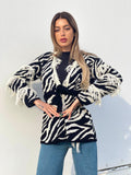 Cardigan zebrato nero con frange e cinta
