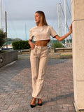 Completo maglia crop e pantalone beige