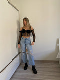 Jeans con strappi e strass