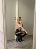 Pantalone in ecopelle con trasparenze