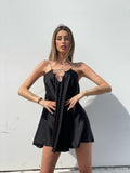 Abito in raso nero con punto luce