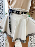 Short in ecopelle bianco con borchie