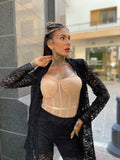 Body con trasparenze e catena nude