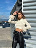 Maglioncino crop panna con piume